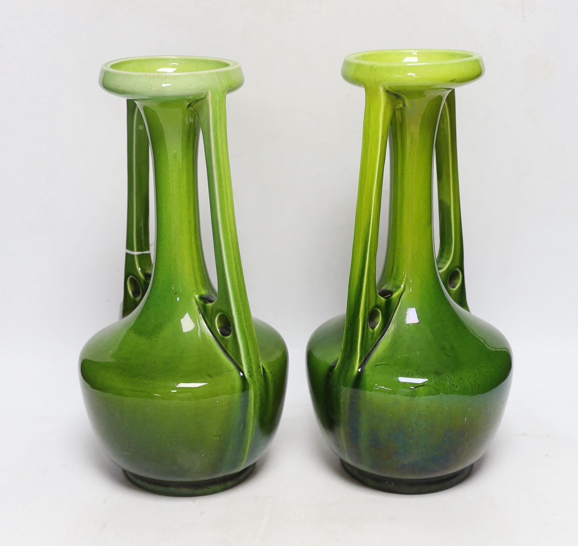 A pair of Bretby Arts and Crafts style vases, impressed model number 1565, circa 1900, 33cm high